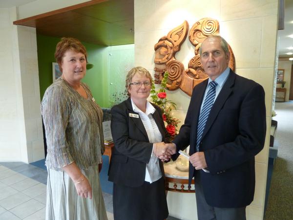 Trust manager Kevin Booth presents a cheque to Kate Mackintosh (nursing director) and Nicki Kitson (chief executive officer) from Hospice Southland for close to $8,000 